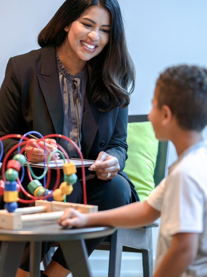 Therapist playing with young patient